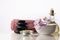 Spa still life with zen stones, orchid flower in bowl, candle, bottle with oil and towel.