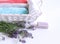 Spa treatment and massage products with towel, aromatic oil ,natural soap and lavender flowers on a white background