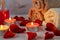 Spa treatment set with scented oil, candles, rose petals and flowers