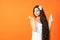Spa and Wellness background with a beautiful indian asian woman with healthy long hair and white mockup cream bottle