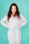 Spa and wellness concept. Girl smiling face long hair wear bathrobe turquoise background. Ready for spa procedures