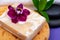 Spa Wellness Concept. Natural Foam Bath&Shower Sea Sponge, Almond Goat`s milk Soap, Basalt Stones, Bamboo and Orchid Flower