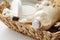 Spa and wellness cosmetic products:body scrub,beech toothbrushes,sea bath salt,soap, wooden hair comb in a wicker basket