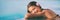 Spa wellness woman relaxing in blue panoramic banner. Happy Asian woman at luxury hotel resort  infinity pool