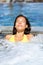 Spa wellness - woman relaxing in hot tub whirlpool