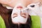 Spa Woman applying Facial cleansing Mask. Beauty Treatments. Clay mask