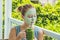 Spa Woman applying Facial green clay Mask. Beauty Treatments. Fr