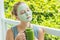 Spa Woman applying Facial green clay Mask. Beauty Treatments. Fr