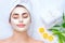 Spa woman applying facial mask