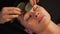 Spa woman facial massage. Face massage in beauty spa salon. Female enjoying relaxing face massage in cosmetology spa