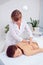 Spa woman. Female enjoying relaxing back massage in cosmetology spa centre. Body care, skin care, wellness, wellbeing