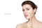 Spa woman using rose quartz face roller on her fresh clean skin. Facial treatments