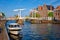 Spaarne river with boat and Gravestenenbrug bridge in Haarlem, Netherlands
