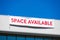 Space Available large banner on vacant commercial office building advertising the real estate, property, office for sale, rent or