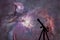 Space background with silhouette of telescope. The Orion Nebula