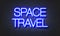 Space travel neon sign on brick wall background.