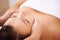 Space, woman and face massage for skincare, holistic therapy or healthy healing at cosmetics salon. Calm client relax at