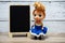 Space wooden easel blackboard with space copy on wooden background