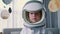 Spaceman form of space hero in suit bumblebee astronaut conquers space in her children's room,interior hung with planets