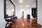 Spacious anteroom interior with large mirror and shiny brown par