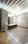 Spacious anteroom interior in warm tones and modern ceiling lights