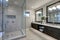 Spacious bathroom in gray tones with heated floors