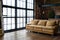 Spacious dark industrial loft room with big black windows and brown sofa