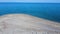 Spacious exotic sand beach with seagulls and beautiful blue sea. Aerial view