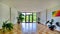 A spacious hall with a balcony, multi-colored tiles on the floor and ornamental plants