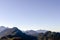 A spacious panoramic view of the Alps mountains covered with colorful trees on a sunny October day near Innsbruck, Austria.