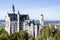 A spacious panoramic view of a romantic ancient castle named Neuschwanstein located in Bavaria Germany