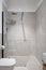 Spacious shower in bathroom with modern patterned tiles