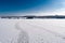 Spacious snow landscape. River and hills in Russia, white winter on the terrain, a lot of fluffy snow and ice under a beautiful bl