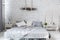 Spacious stylish modern trendy loft apartment in white and light colors. a large room full of sunlight. brick wall  wood floor