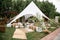 Spacious tent in the garden for a wedding party