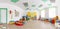 Spacious white game room in the kindergarten. Wide Panoramic Picture.