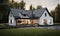 A spacious white house with a striking black roof