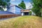 Spacious wooden fenced backyard area. Countryside blue house.