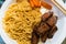 Spagetti Pasta with meat carrots white plate