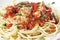 Spaghetti all\'arrabbiata with fish side view