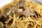 Spaghetti with artichokes, close-up