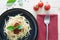 Spaghetti on back dish with fresh tomatoes basil italian herbs