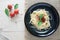 spaghetti on back dish with fresh tomatoes basil italian herbs