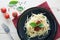 spaghetti on back dish with fresh tomatoes basil italian herbs o