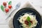 spaghetti on back dish with fresh tomatoes basil italian herbs o