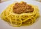 Spaghetti bolognese. Classic Italian pasta made with spaghetti and tomato sauce with ground beef and spices on a