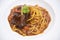 Spaghetti bolognese sauce with pork ribs roast on white plate, Traditional italian spaghetti