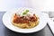 Spaghetti Bolognese on a white plate