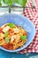 Spaghetti with calamary tomatoes and basil