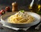 Spaghetti carbonara with ham and cheese in a plate on a black background. AI-generated image